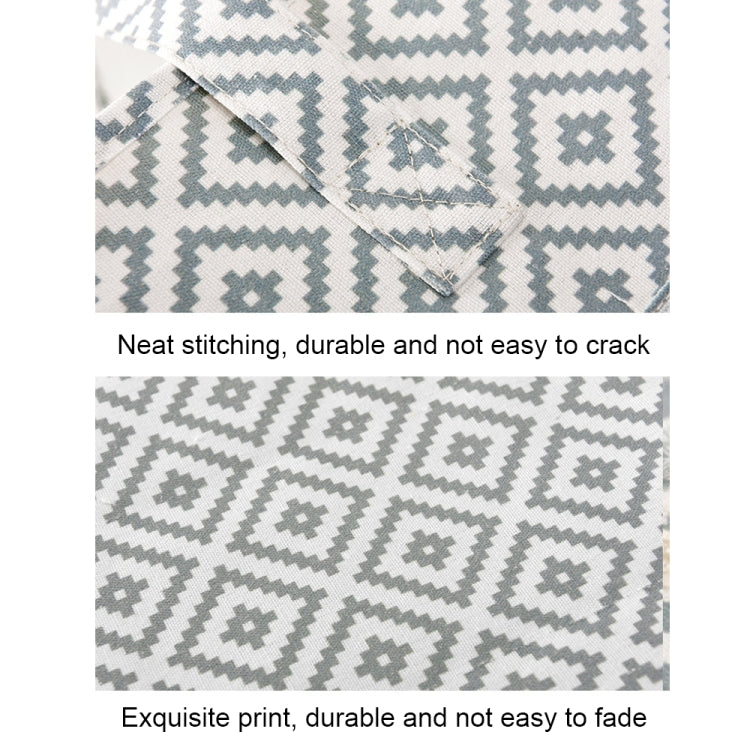 Close-up of woven fabric with zigzag stitching and repeating geometric pattern