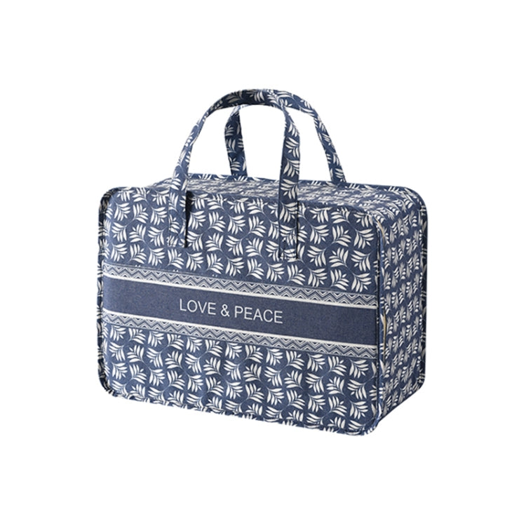 Blue leaf-pattern fabric organizer bag with reinforced top handles and front label