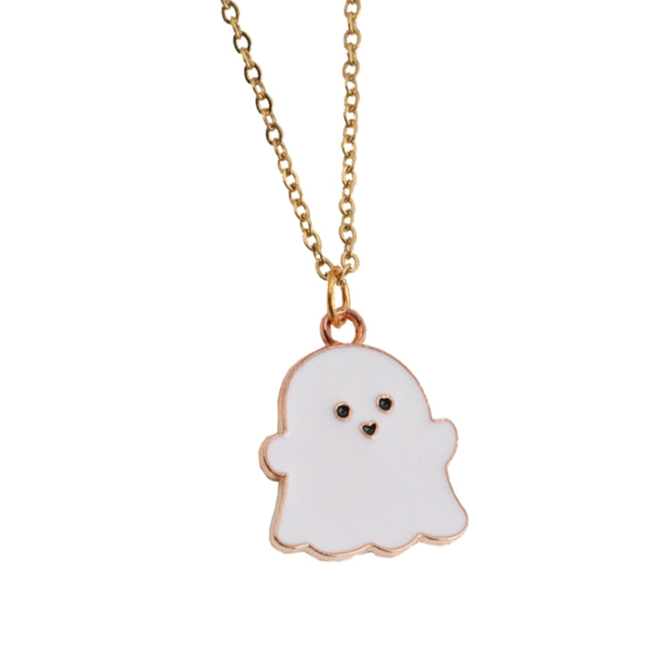 White ghost pendant necklace with gold-tone chain and small face detail.