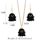Black ghost charm earrings with gold-tone hooks and smiling face detail; necklace length shown.