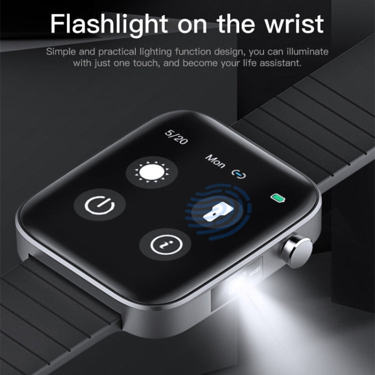 Black smartwatch on black strap with bright flashlight beam near the wrist.