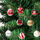 Christmas ball decorations on a tree, red white green and gold hanging ornaments