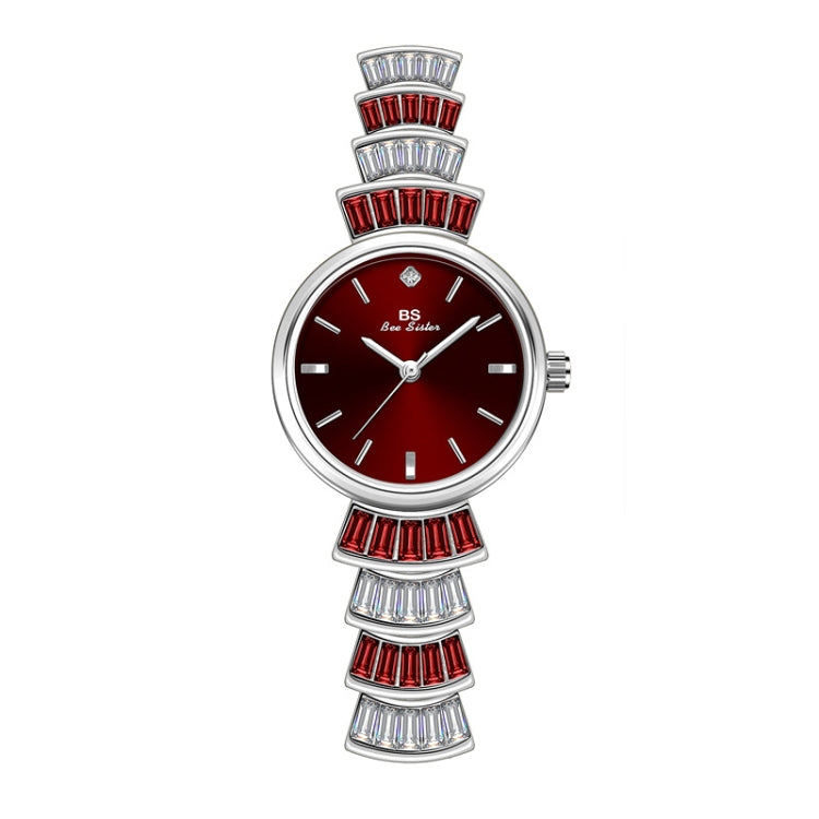 Ladies wrist watch with red dial, silver-tone case, and red and crystal bezel accents