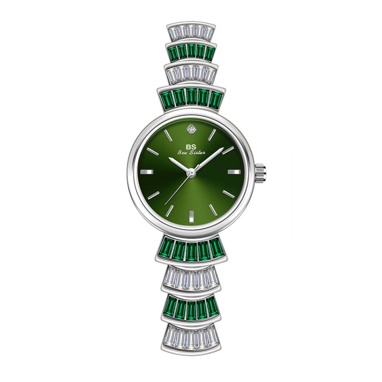 Ladies wrist watch with green dial, silver-tone case, and green and crystal bezel accents