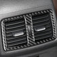 Installed carbon-fiber air outlet trim with two vents, center tab, and divider