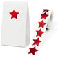 Red glitter star sealing stickers on a white gift box and sticker strip