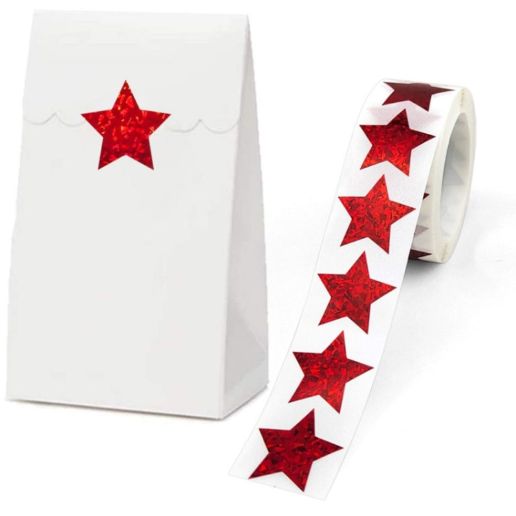 Red glitter star sealing stickers on a white gift box and sticker strip