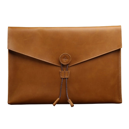 Brown leather business briefcase with front flap and drawstring strap