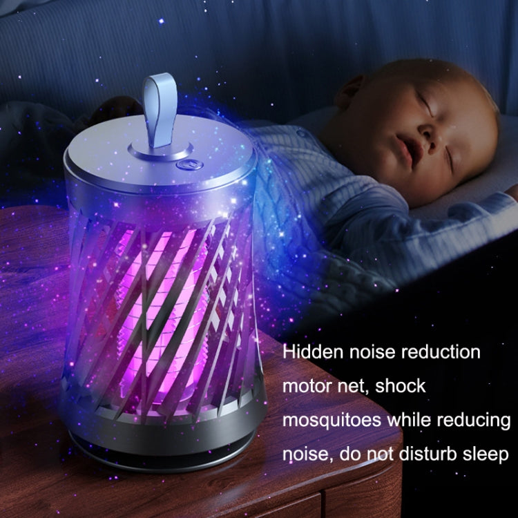 Mosquito killer night light with purple light glow and top handle on bedside table