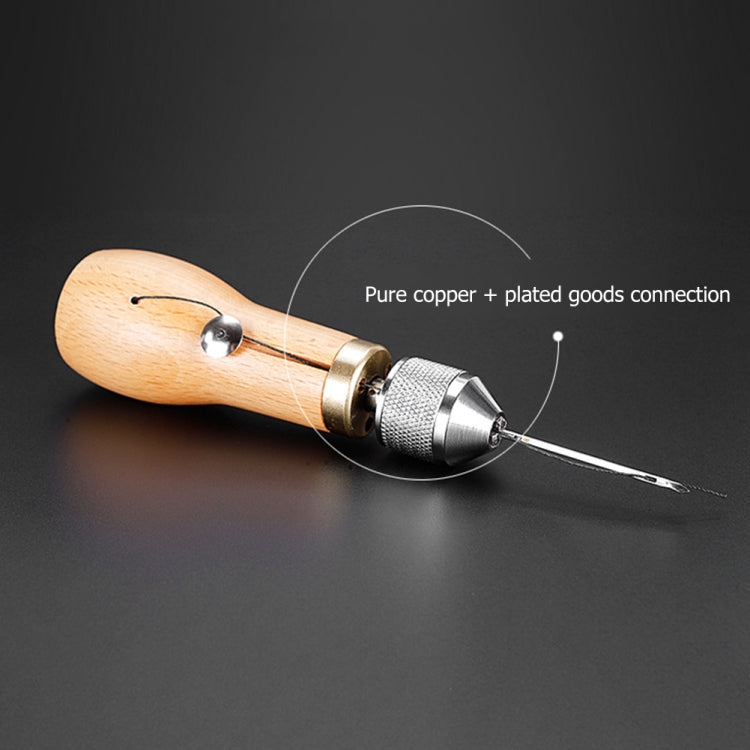Leather stitching tool with wooden handle, brass ring, and pointed steel needle
