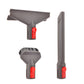 Vacuum accessory tools: wide floor brush, crevice tool, and two brush heads with red buttons.