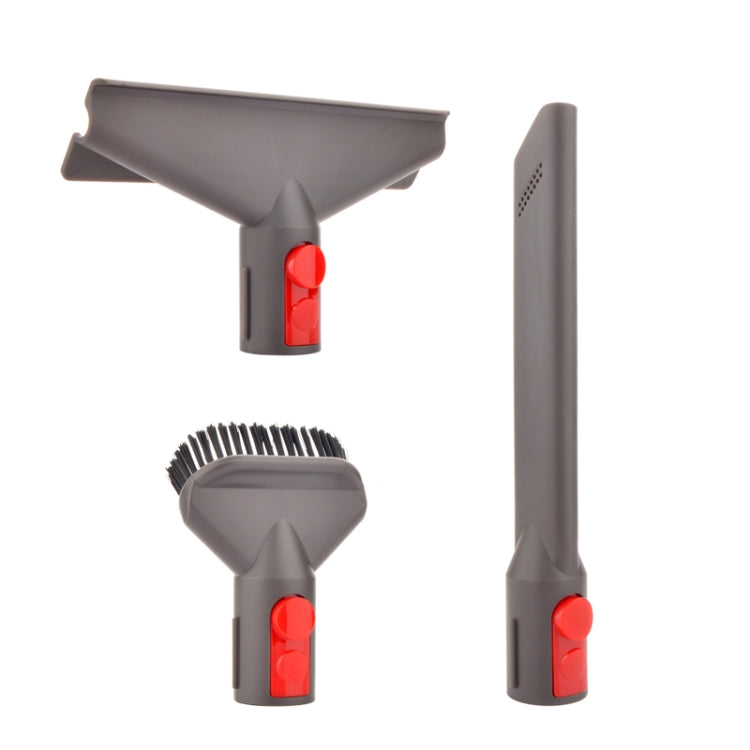 Vacuum accessory tools: wide floor brush, crevice tool, and two brush heads with red buttons.