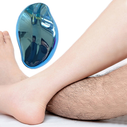 Light blue oval manual foot peeler shaver on leg, handheld exfoliating head