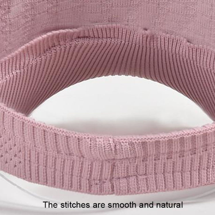 Pink knitted cap edge close-up with smooth stitching along the inner band.
