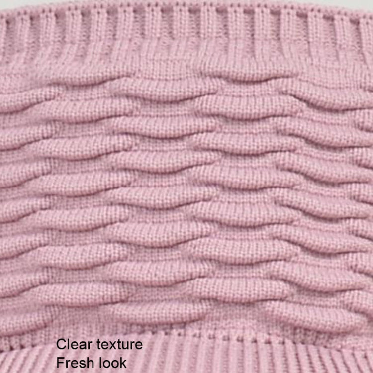Pink ribbed knit peaked cap fabric close-up