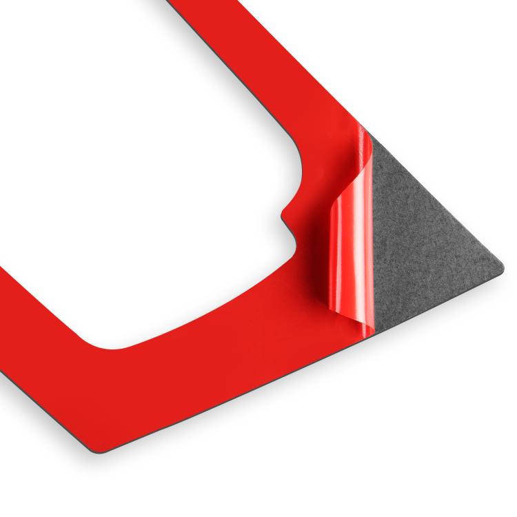 Black carbon-fiber sticker corner showing protective backing layer