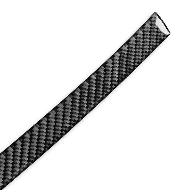 Carbon fiber-look radio panel upper trim sticker, close-up black weave texture