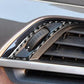 Installed carbon-fiber air vent trim stickers around dashboard vent knob control