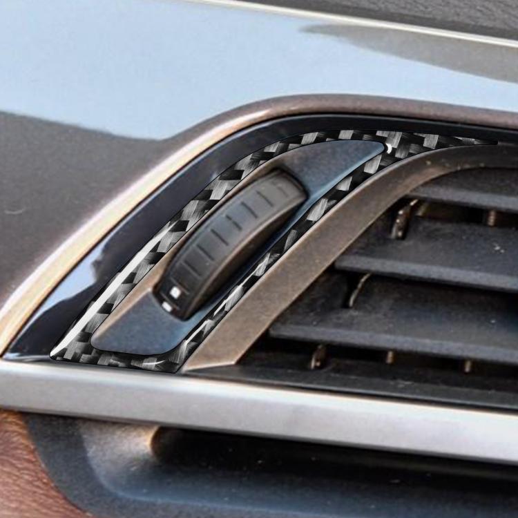 Installed carbon-fiber air vent trim stickers around dashboard vent knob control