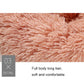 Pink plush pet bed long-hair shag texture close-up