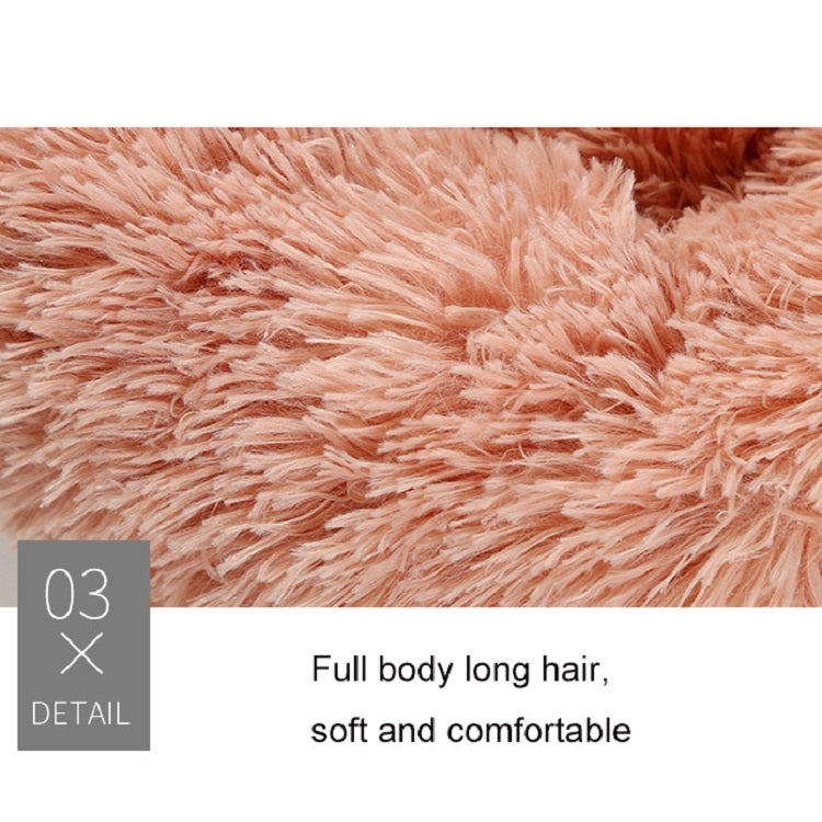 Pink plush pet bed long-hair shag texture close-up