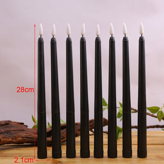 Set of 4 tall black LED candles with lit flame tips, 28 cm height shown