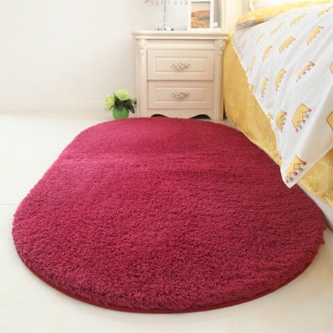 Magenta oval plush pet bed pad with dense shag fabric