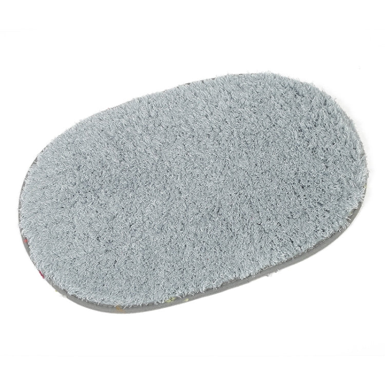 Grey oval plush pet bed pad with soft shag pile and flat surface