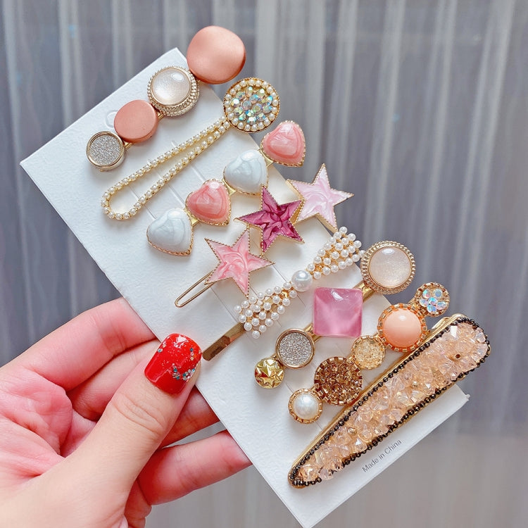 Colorful hair clip set with hearts, star pins, pearls, and gold hair grips