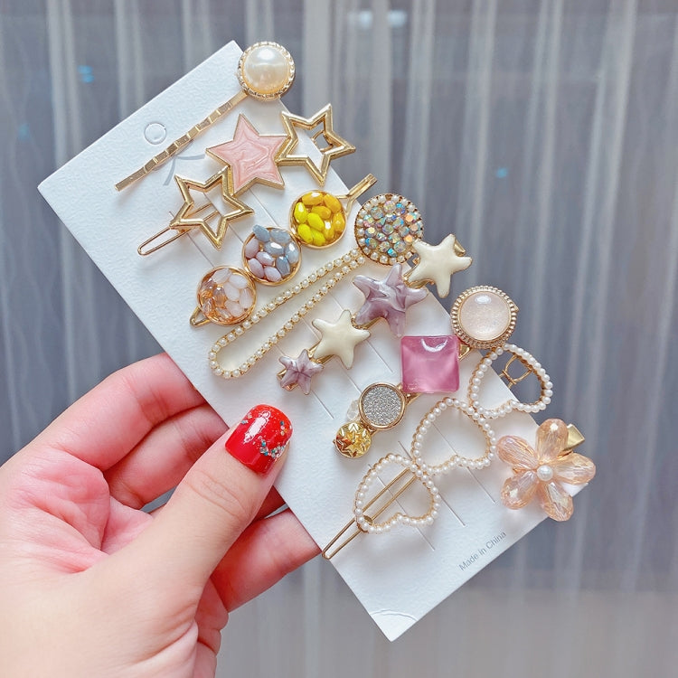 Star-themed hair clip set with rhinestone stars, pearl beads, and pastel charms