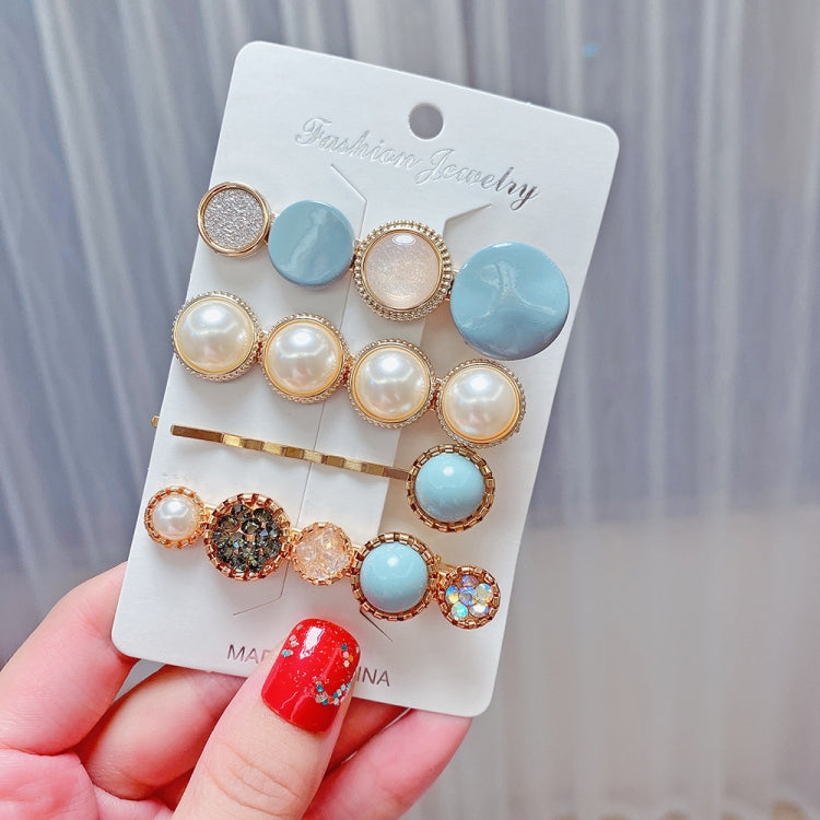 Moon and pearl hair clip set with round blue beads and gold rhinestone accents