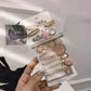 Pearl and rhinestone hair clip set with gold-tone barrettes and charm details