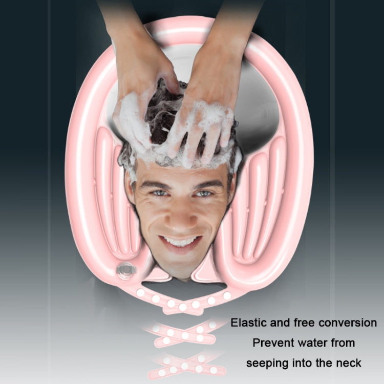 Person washing hair in a pink reclining shampoo basin with hands under running water