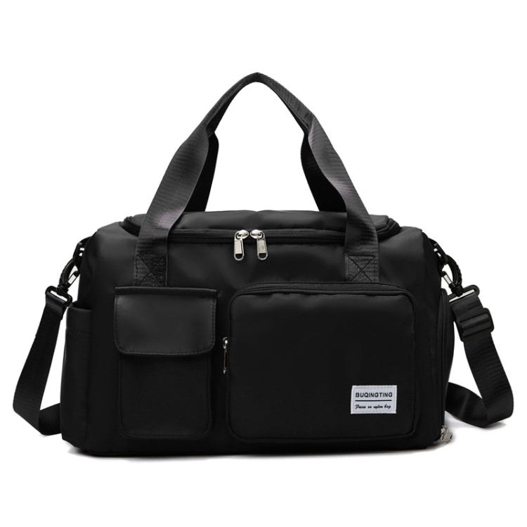 Dark black waterproof travel gym bag with front zip pockets, dual handles, and shoulder strap