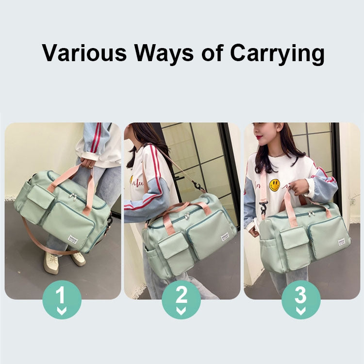 Light teal duffel bag with pink handles, carried by hand or shoulder