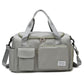 Light grey waterproof travel gym bag with front zip pocket and dual carry handles