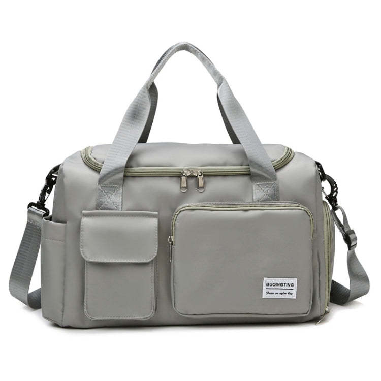 Light grey waterproof travel gym bag with front zip pocket and dual carry handles