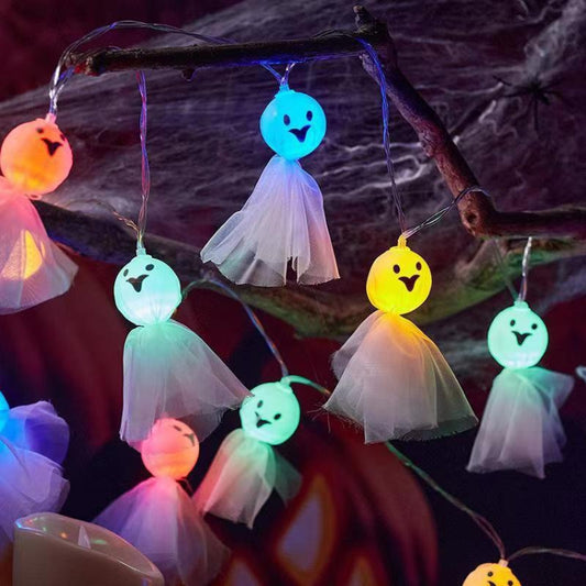 Colorful LED ghost string lights with glowing tulle ghost ornaments in blue, yellow, and pink