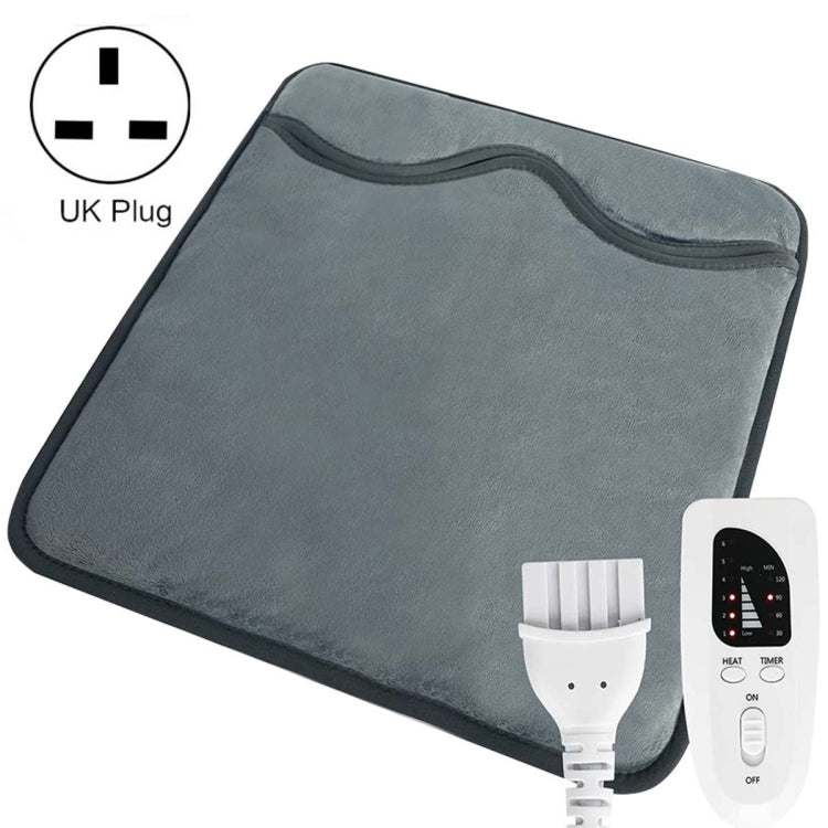 Dark gray electric foot warmer pad with controller remote and power cord