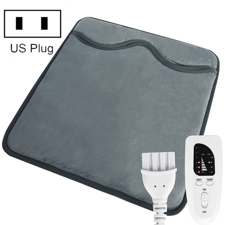 Dark gray electric foot warmer pad with attached cable and controller remote