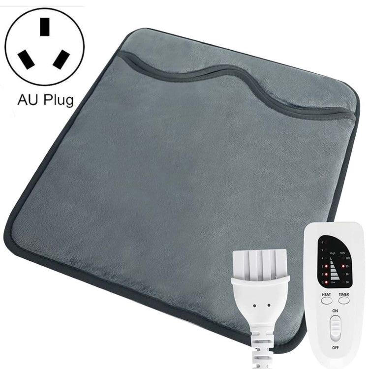 Dark gray electric foot warmer pad with controller remote and power cable