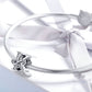 Silver charm bracelet with letter charm featuring zircon inlay detail