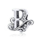 Silver-tone letter B charm with round rhinestones and curled filigree