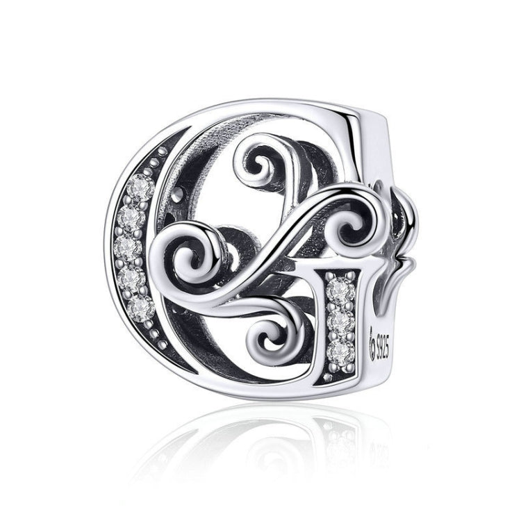 Silver-tone letter G charm with round rhinestones and filigree swirls