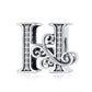 Silver-tone letter H charm with round rhinestones and side swirl accents