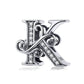 Silver-tone letter charm with black enamel and rhinestone accents, cursive “K” style