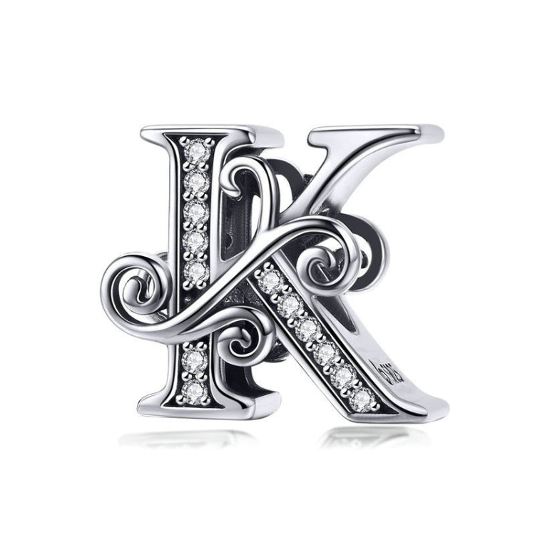 Silver-tone letter charm with black enamel and rhinestone accents, cursive “K” style