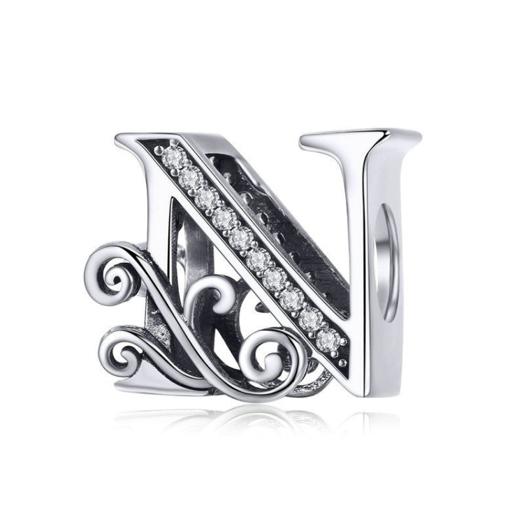 Silver-tone letter charm with black enamel and rhinestone line, cursive “N” style