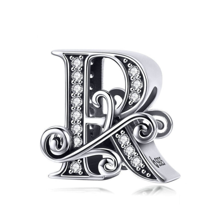 Silver-tone letter charm with black enamel and rhinestone accents, cursive “R” style