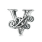Silver letter charm with black enamel and clear zircon sparkle accents